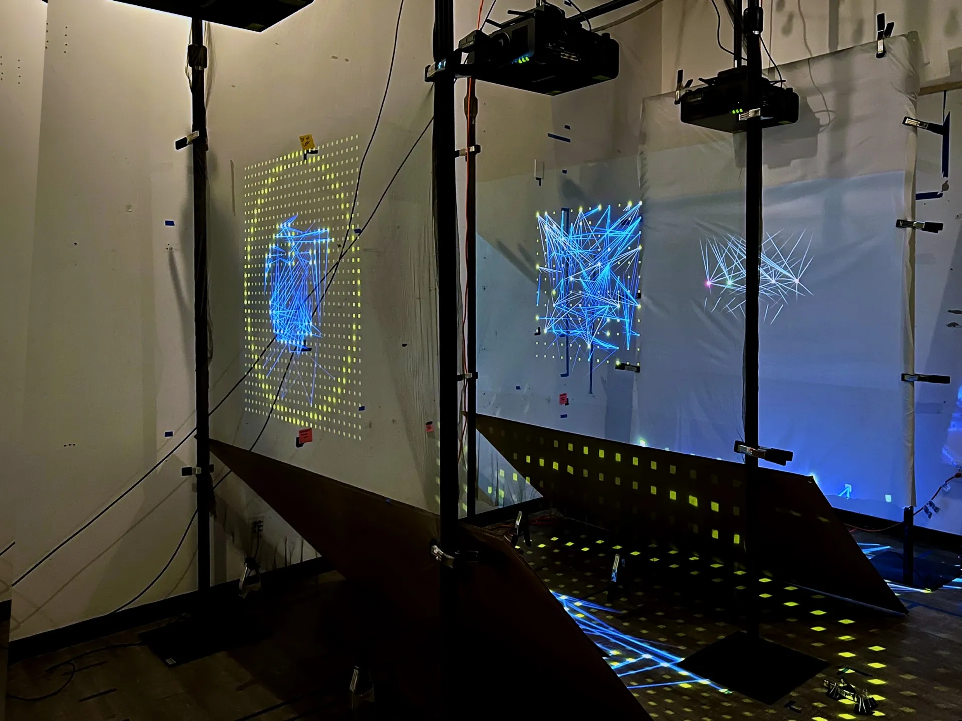 Projection tests on hanging scrims in the studio.