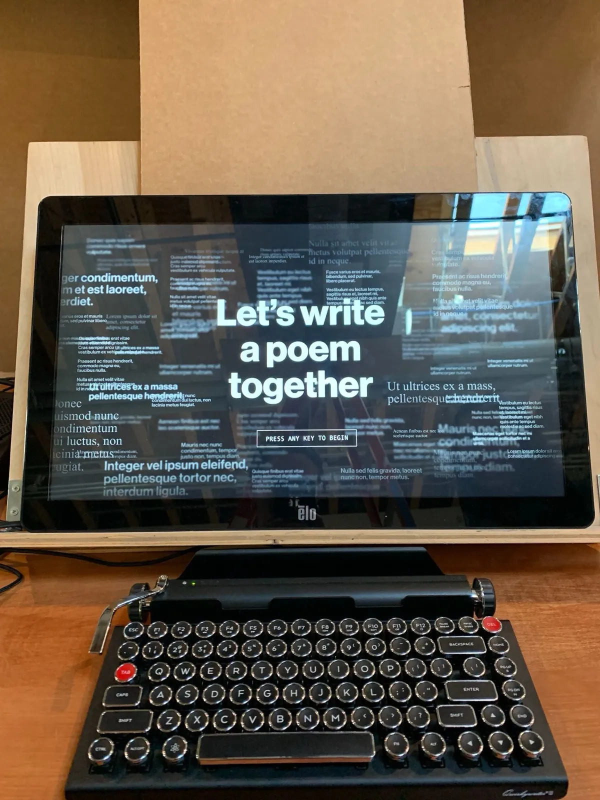 A physical keyboard connected to the writing prototype.